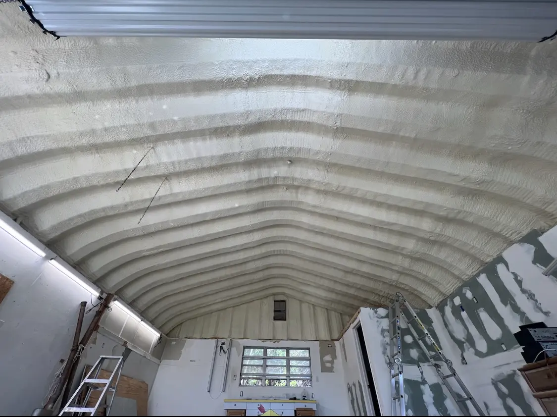 Spray polyurethane foam applied to the underside of a metal roof deck in St. Charles